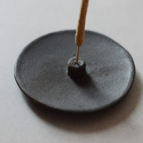 raw black clay incense holder and incense stick