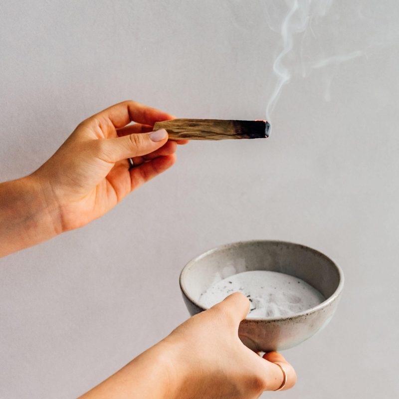 smudging wood stick and bowl